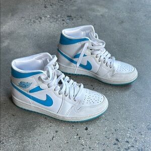 Nike Air Jordan 1 Women’s White and Blue Mid ‘UNC’ Sneakers